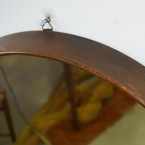 This excellent handcrafted circular vintage mid century teak wall mirror was manufactured in Italy, ca 1960\. Great...
