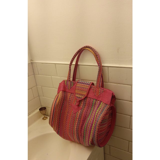 This is a striking lightweight contemporary African hand-woven basket beautifully executed in a vibrant, high-contrast...