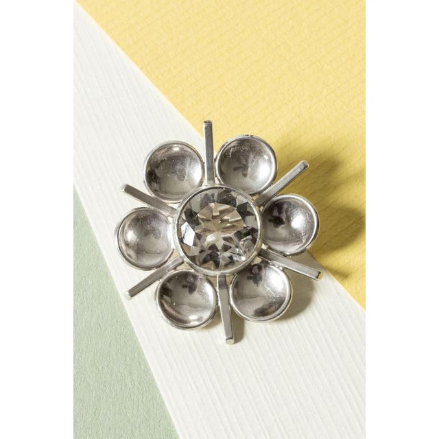 Lovely silver brooch from Victor Jansson in a form that brings flowers and snowflakes to mind. Adorned with a sparkly rock...