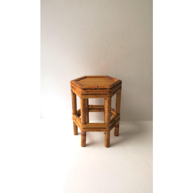A wicker bamboo pedestal stand, circa 1970s, Asia. A great piece to hold a drink, books, a plant, etc. Piece is on the...