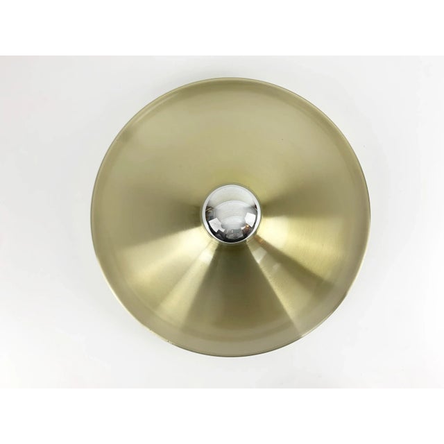 Flush Light in light gold finish, produced in Germany during the 1960s or 1970s. Charlotte Perriand used these lights in...