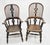 A pair of broad armed Windsor chairs in oak with elm seats Probably a his and hers set Circa 1860 Very solid and sturdy,...