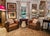 This magnificent pair of French Art Deco lounge or club chairs features original leather and stitching, wood bases, and...