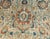 An antique Persian Tabriz carpet, the oatmeal field with an orange-accented palmette, cloud band and floral spray field...