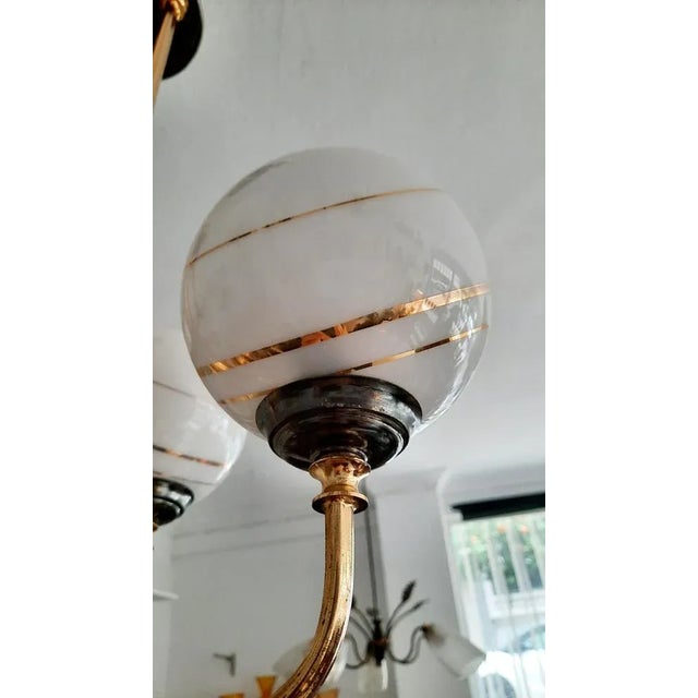 Sputnik Opaline Bronze Chandelier, 1970s, in Good conditions. Designed 1970 to 1979 Up to 250V (Europe/UK Standard).The...