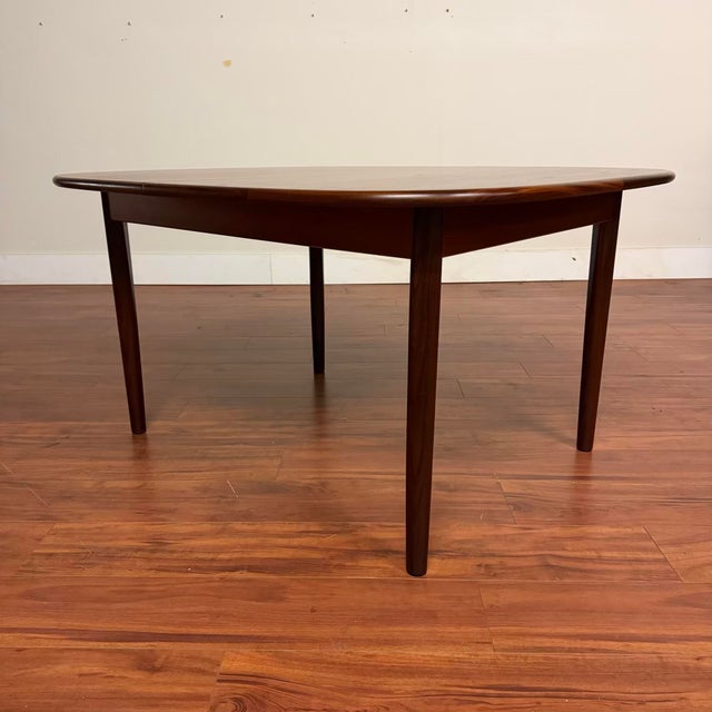 Vintage mid-century rounded corner dining table made in the U.K. by G-Plan circa 1960's. This piece features a beautiful...
