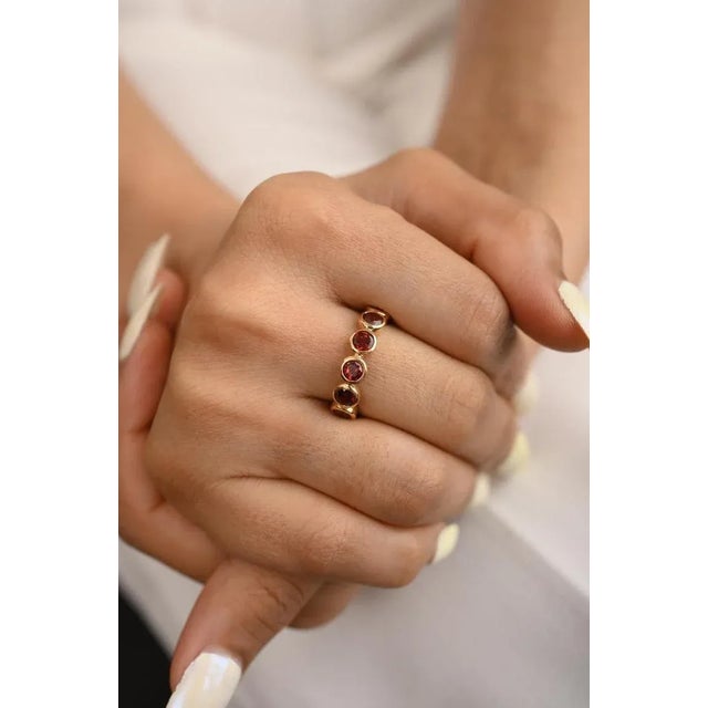 This is part of Chairish’s Fine Jewelry assortment. Art Deco Deep Red Garnet Eternity Full Band Ring in 18K Gold...