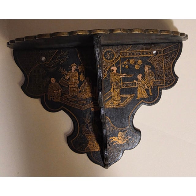 Rare 19th century black chinoiserie wall bracket with wonderful scenes.