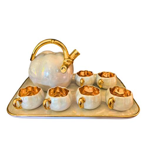 Adorable digestive set with its 6 small pumpkin-shaped cups and its presentation tray in Limoges porcelain. Beautiful...