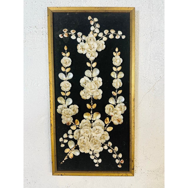 This vintage piece is a beautifully intricate shellwork artwork, often referred to as shell art or sailor’s valentine-...