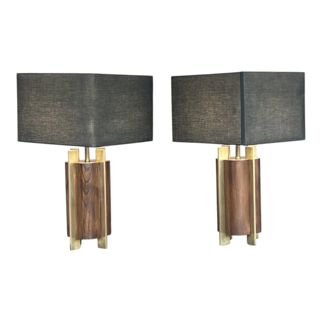 This striking pair of Mid-Century Modern table lamps showcases a sculptural design that blends warm wood tones with clean...