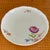 Meissen scalloped edge 9 1/2 inch floral motif serving bowl. With a large hand painted purple/pink flower and smaller...