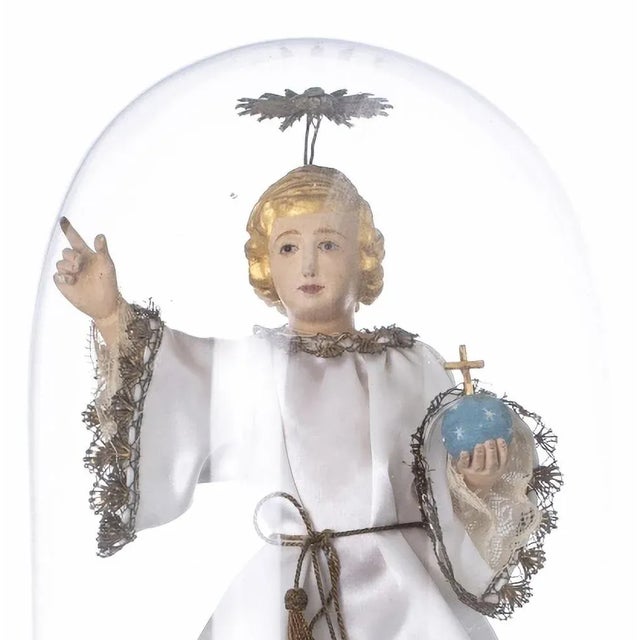 Child jesus savior of the world 18th century portuguese sculpture in polychrome and gilded wood with fabric cover. Mounted...