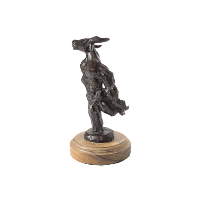 A 1999 bronze sculpture of a minotaur by American artist Marco A. Ovideo. The minotaur stands, leaning slightly to the...