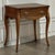 Crafted in the Netherlands during the 18th century, this charming antique oak end table captures the graceful movement and...