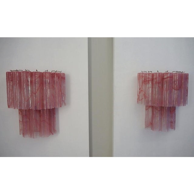 Italian vintage pair of wall sconces in Murano glass and nickel-plated metal structure. The armor polished nickel supports...