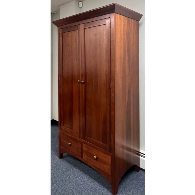 Mission style solid cherry armoire Made in the USA, by Ethan Allen from their “American Impressions” collection. Simple...