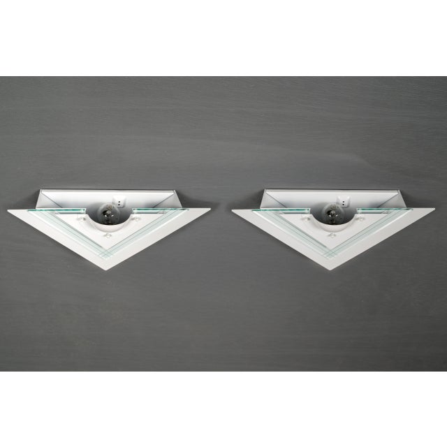 A stylish pair of wall lights by hustadt, a designer and manufacturer known especially for hotel lighting and smaller...