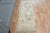 Vintage Hand-Knotted runner rug is a semi-antique vintage area rug. The '70s Eastern region of Anatolia's unique rug is...