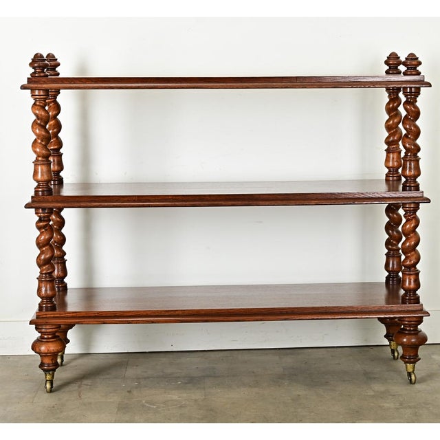 Dimensions: 48 ⅜” H x 57 ¼” W x 19 ¾” D A gorgeous serving trolley, made of richly figured oak planks and barley-twist...