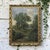 An atmospheric Belgian oil painting on canvas by Georges Crehay depicts a secluded country landscape beneath a softly...