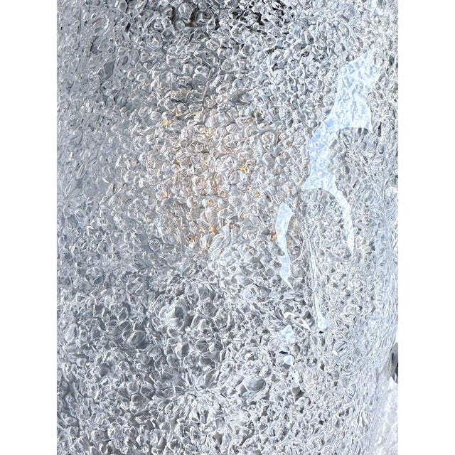 Contemporary luxury modern wall sconces made in transparent hammered murano glass with a traditional working of...