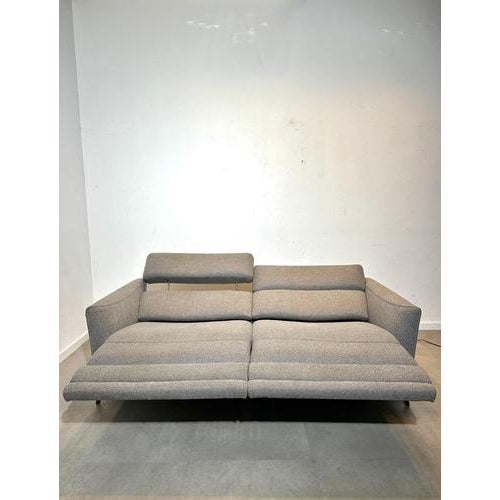 Elegant and modern two-seater reclining sofa by Natuzzi, combining Italian craftsmanship with premium comfort. This sofa...