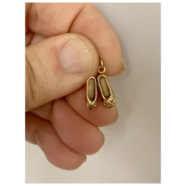 Adorable 3D ballet slipper charm/pendant in 14k gold. Wonderful detailing, complete with ribbons on each toe. Perfect for...