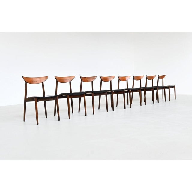 Beautiful set of eight dining chairs designed by Harry Østergaard for Randers Møbelfabrik, Denmark, 1960. These sculptural...
