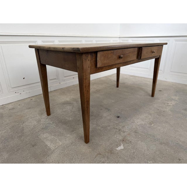 Measuring 153 cm in length, this antique 1930s farmhouse table is crafted entirely from high-quality solid oak. Cleaned...