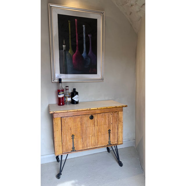 A handsome mid‑century drinks cabinet, french, c.1950s–60s sourced on a recent trip to paris. The exterior is clad in slim...
