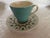 A set of 8 Metlox cups and saucers in the Poppyfield pattern. The cups are turquoise on the outside and white in the...