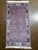 Hand-knotted Nepal wool rug featuring a solid mauve field framed by a decorative border with stylized geometric motifs....