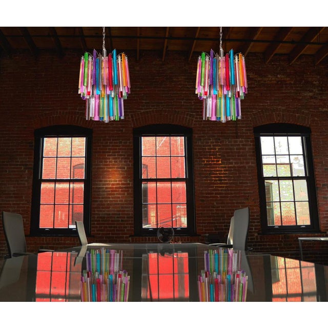 Fantastic vintage murano chandelier made by 107 murano crystal multicolored prism in a nickel metal frame. The glasses are...