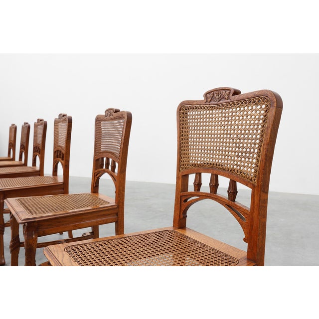 A graceful and expressive ensemble, this set of six Art Nouveau dining chairs captures the fluid elegance and organic...