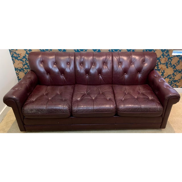 1970s leather sofa with tufted tight back and turfed loose seat cushions