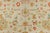 An enormous Turkish Oushak in candy color accents on a bone color ground. Full pile excellent condition. Measures: 14'5''...