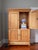 Looking for the perfect place to conceal your TV? Look no further. This early to mid 20th century English pine linen press...