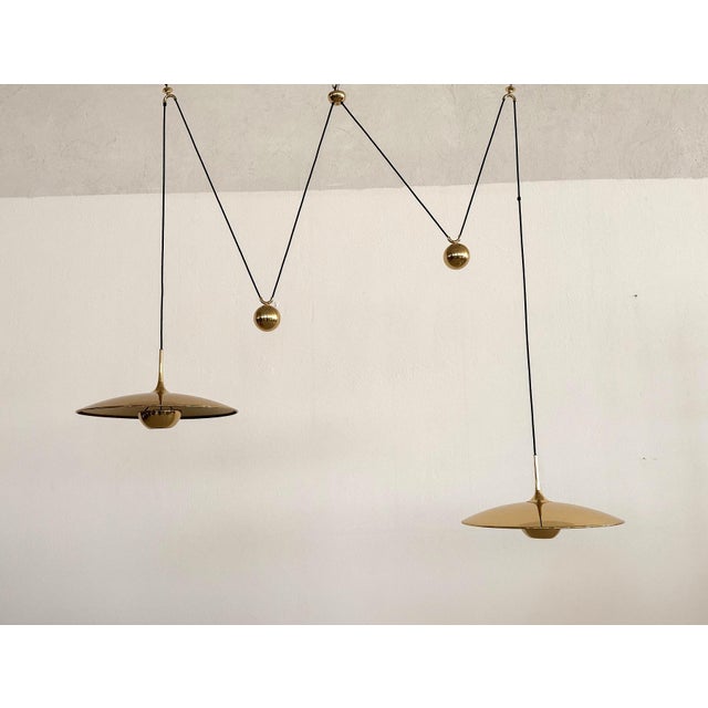 Beautiful and shiny full brass double pendant lights of big diameter 55cm (21.6in) with heavy counter weights. designed by...