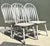 Bring timeless farmhouse charm to your interior with this set of four vintage Windsor dining chairs, beautifully crafted...