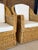 A beautiful pair of vintage woven rattan and wicker lounge armchairs featuring sculptural curved backs, gracefully sloping...