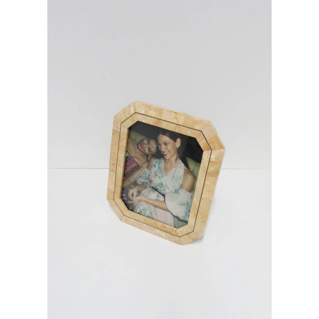 A beautiful '80s marble and brass picture frame by designer Maitland-Smith, circa late-20th century, 1980s. Frame is...