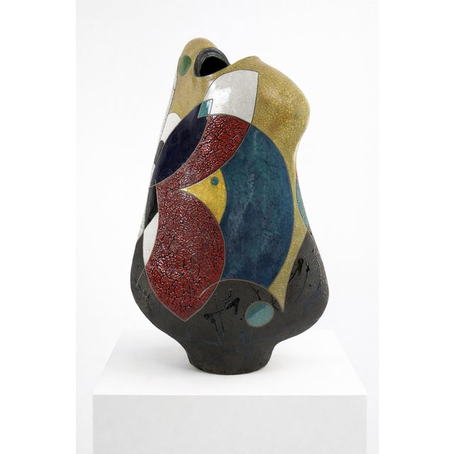 The form tilts and curves as if caught mid-movement, shaped by a hand-stretching process that pushes the clay beyond what...