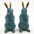 Pair antique 19th century Chinese blue and gold cloisonné rabbits. Each stands upright on its haunches. Measure 7" tall x...