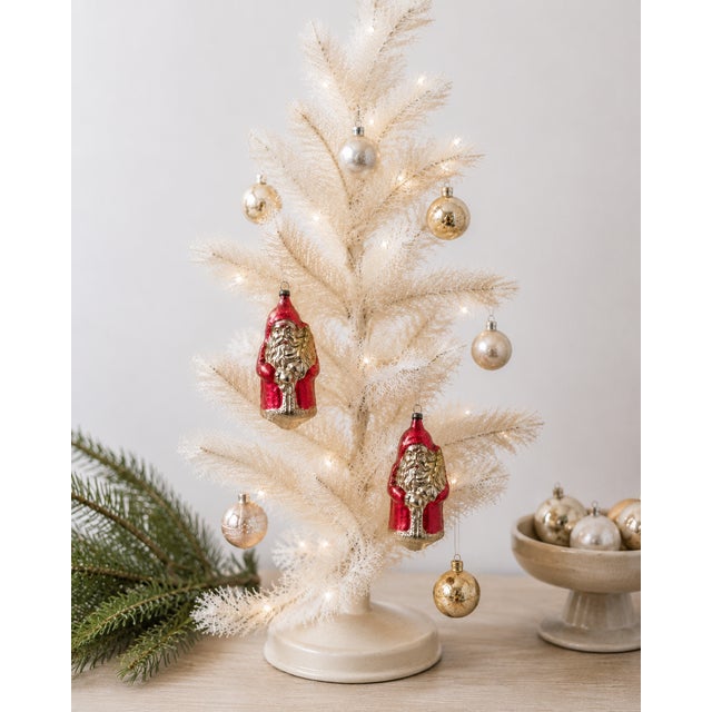 A charming pair of antique German mercury glass Santa Claus Christmas ornaments featuring richly hand-blown molded figures...