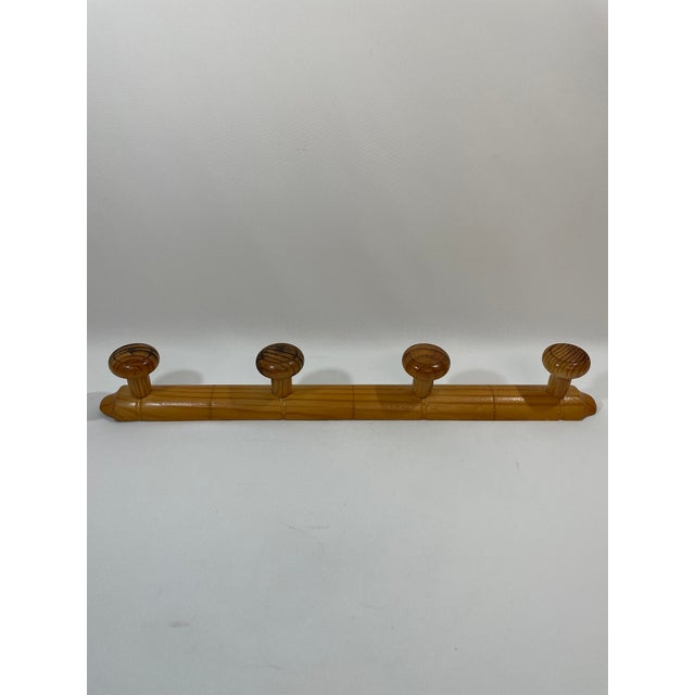 A fine French four peg Faux Bamboo (Chambre en Bambou) wooden wall coat and hat rack made in France. Circa 1960s-70s. This...