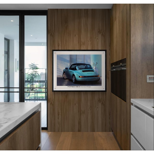 An original 1990 promotional poster for the Porsche 911 Carrera 2 Targa, printed in Germany. This piece highlights the...