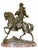 A finely cast bronze equestrian sculpture by French artist Alfred Barye, depicting a mounted cavalier in dynamic motion....