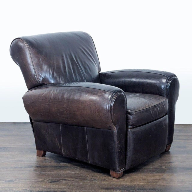 This Pottery Barn lounge chair is made with rich brown leather and features a comfortable recliner function. The chair has...
