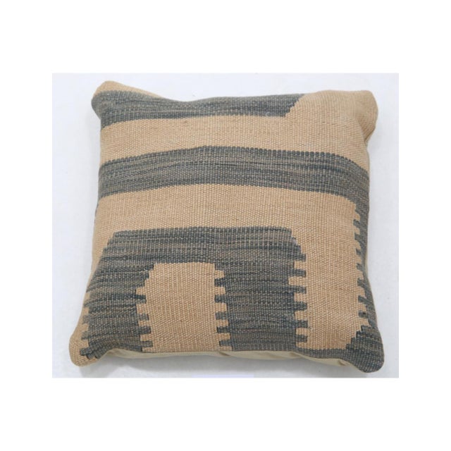 A sand and slate gray stepped block kilim throw pillow by Arteverk, 17 x 17 inches, with a handwoven Afghan wool kilim...